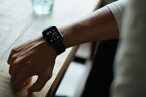 man wearing black smartwatch